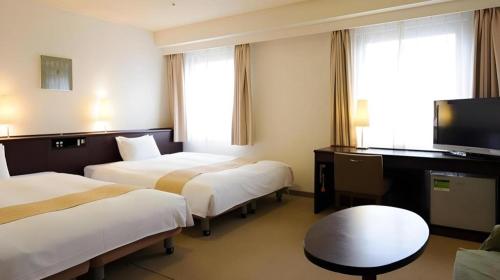 Ένα ή περισσότερα κρεβάτια σε δωμάτιο στο Chisun Hotel Utsunomiya