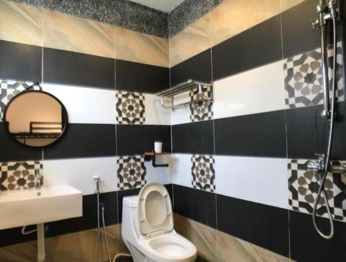 a bathroom with a toilet and a sink at Kinta Valley Retreat in Ipoh