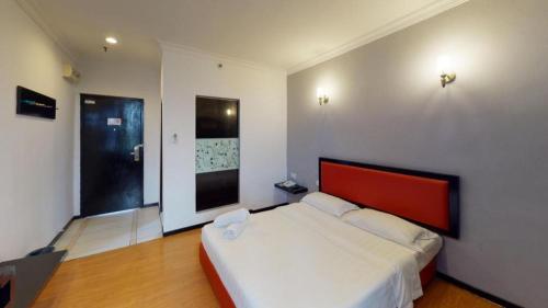 Ένα ή περισσότερα κρεβάτια σε δωμάτιο στο Golden Hotel