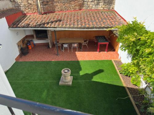 an aerial view of a patio with a table and chairs at Casa Leuza in Espronceda