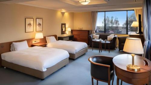Ένα ή περισσότερα κρεβάτια σε δωμάτιο στο Hotel Eclair Hakata