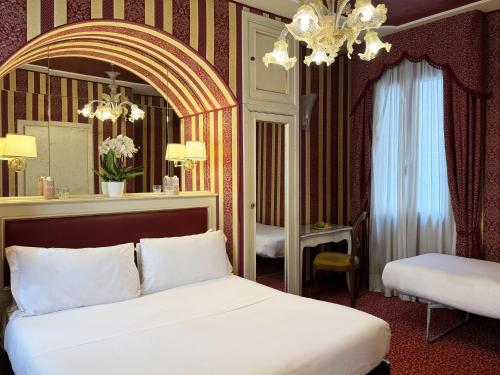Postel nebo postele na pokoji v ubytování Hotel Alcyone