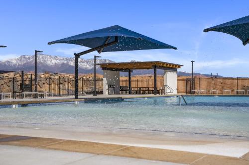 a swimming pool with a gazebo and water at Adventure Basecamp townhouse in Washington