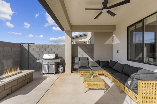 a patio with a couch and a grill at Adventure Basecamp townhouse in Washington
