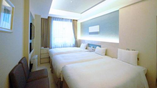 Hotel Riverge Akebonoにあるベッド