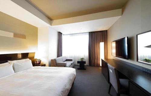 Hotel Riverge Akebonoにあるベッド