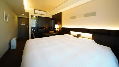 Hotel Riverge Akebonoにあるベッド