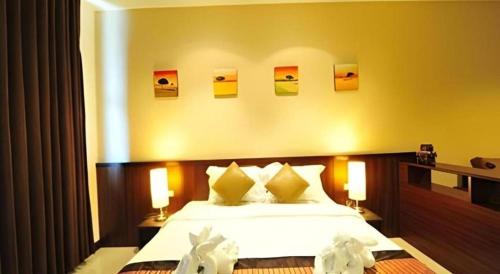 Кровать или кровати в номере Green World Palace Hotel