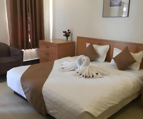 Postel nebo postele na pokoji v ubytování RUBY HOTEL
