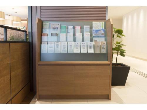 a display case in a store with books in it at KEIKYU EX INN Keikyu Kawasaki-Station in Kawasaki
