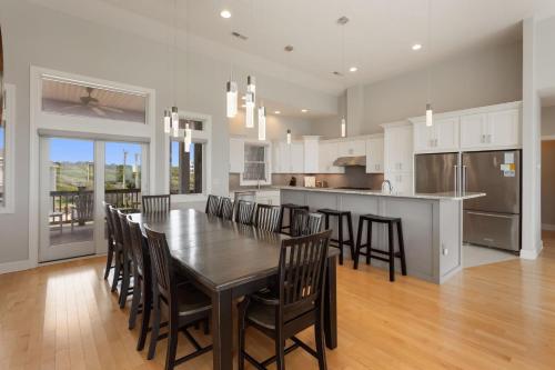 a kitchen and dining room with a table and chairs at 3025 - Who's On First in Southern Shores