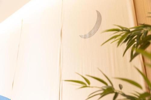 a picture of a crescent moon on a wall at KEIKYU EX INN Tokyo Nihombashi in Tokyo