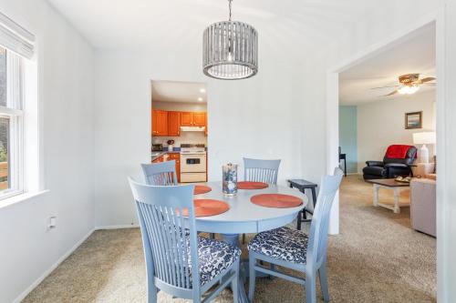 a dining room and living room with a table and chairs at 8635 - High on the Hill in Frisco