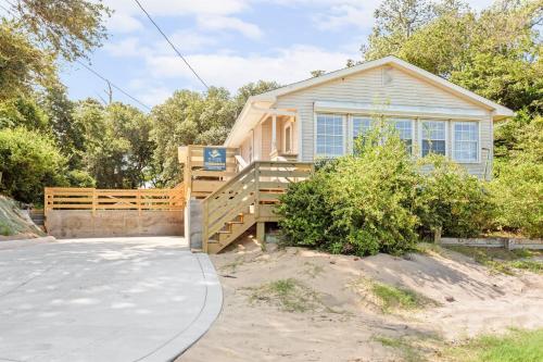 a house with a wooden gate and a driveway at 8635 - High on the Hill in Frisco