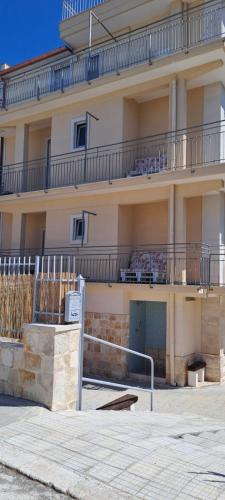 a building with balconies on the side of it at Case Vacanza Torre Canne in Torre Canne