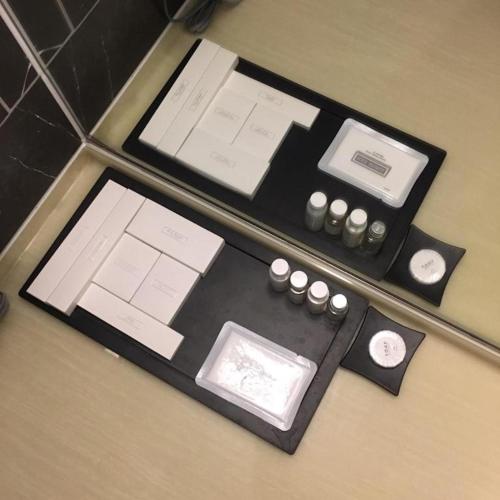 a table with a bunch of stationery on it at Hotel Dongbang in Jinju