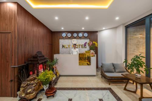 a lobby with a reception desk in a building at KLY Hotel Vung Tau in Vung Tau