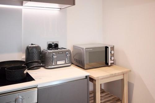 Η κουζίνα ή μικρή κουζίνα στο Leeds City Centre Luxury Penthouse with Private Terrace
