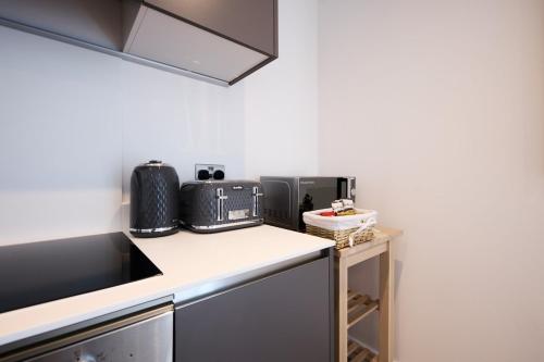 Η κουζίνα ή μικρή κουζίνα στο Leeds City Centre Luxury Penthouse with Private Terrace