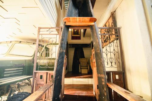 a stairway leading up to a room in a house at Suankaew​ art​ hostel​ in Chon Buri