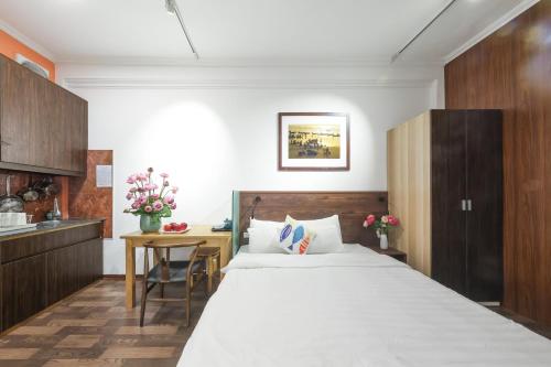 Giường trong phòng chung tại An Huy Apartment