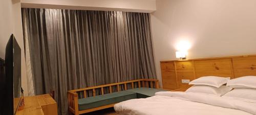 Cama o camas de una habitación en Sintik Residency