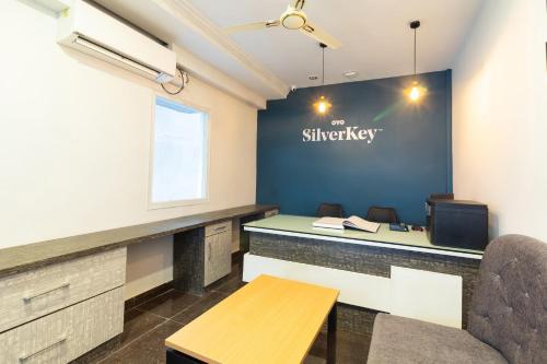 an office with a desk and a sign on a wall at THE STROBE SILVERKEY HOTEL in Hyderabad