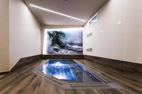 an art gallery with a painting on the wall at tecnopolo aparthotel in Bologna