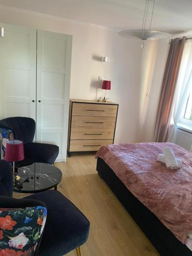 Postel nebo postele na pokoji v ubytování Dom Gościnny Koliber nad morzem w Darłówku