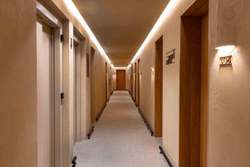 a hallway of a building with a long corridor at Upon Vila - Alcochete Hotel in Alcochete