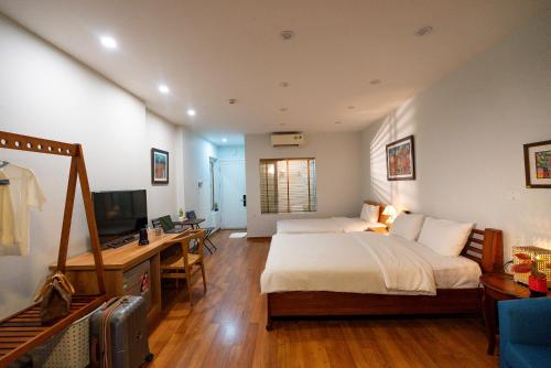 Ένα ή περισσότερα κρεβάτια σε δωμάτιο στο Picturesque Hanoi Homestay