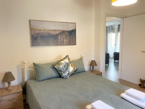 a bedroom with a bed with two pillows on it at Magda's Cosy House Fourka in Fourka