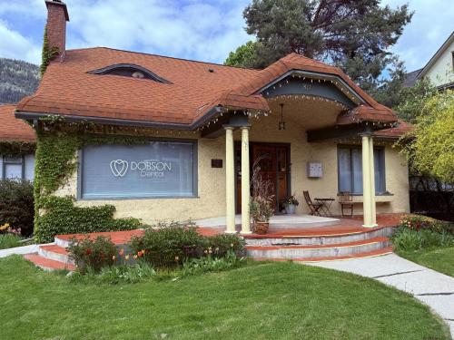 a house with a sign on the front of it at Mistiso's Place Vacation Rentals in Nelson