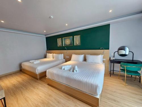 Postel nebo postele na pokoji v ubytování Theessence hotel chanthaburi