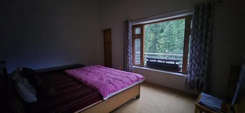 Postel nebo postele na pokoji v ubytování Soyal Orchard Retreat- Vanvaas