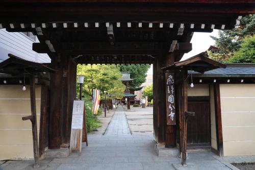 an entrance to a building with a walkway at Country Hotel Takayama in Takayama
