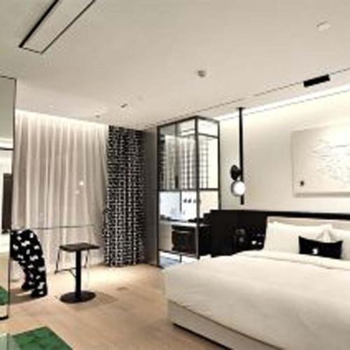 Postel nebo postele na pokoji v ubytování Yashan Tianlai S Hotel (Taikoo Li Chengdu Branch)
