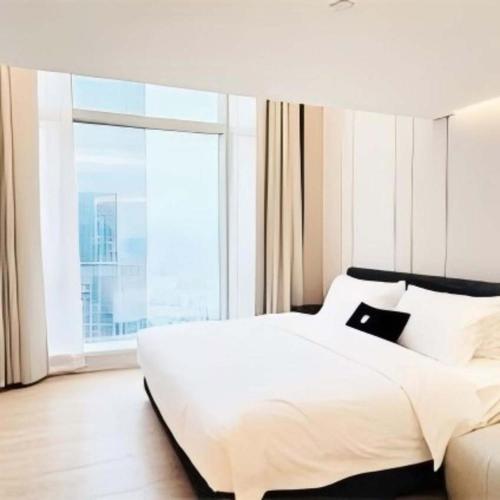 Postel nebo postele na pokoji v ubytování Yashan Tianlai S Hotel (Taikoo Li Chengdu Branch)