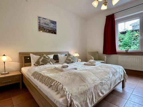 Postel nebo postele na pokoji v ubytování Ferienanlage "Uns Wiek Hus" Ferienwohnung 1