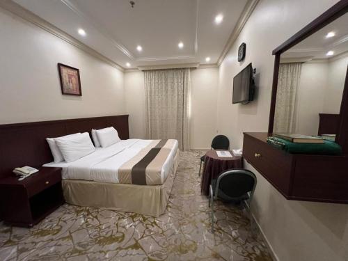 Postel nebo postele na pokoji v ubytování Verta Alshisha Hotel