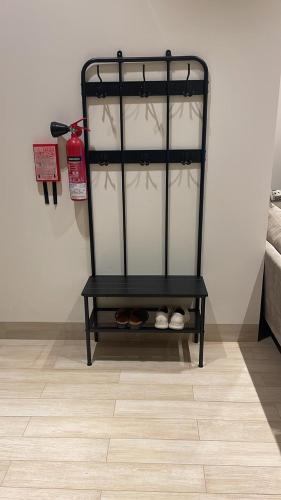 a black shelf in a room with shoes at The Hawana Pearl لؤلؤة هوانا in Salalah