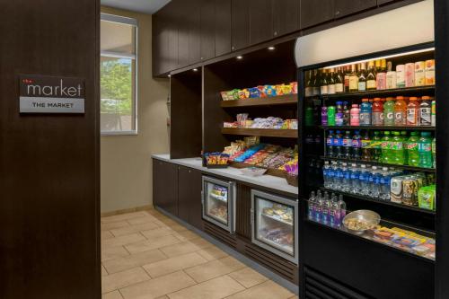 a grocery store aisle with soda and drinks at Courtyard Pittsburgh Settlers Ridge/Robinson Township in Robinson Township