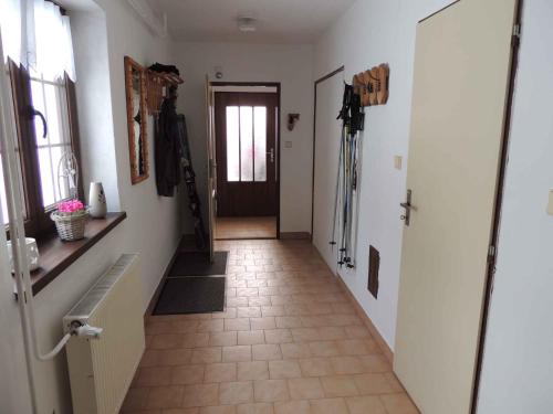 a hallway with a hallway leading to a door at Holiday home Sedlonov - Adlergebirge 949 in Sedloňov