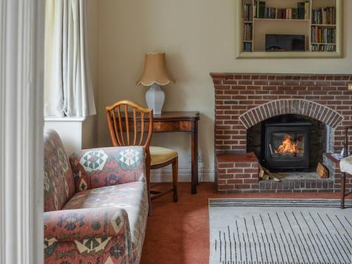 a living room with a couch and a fireplace at Number Three in Bridlington