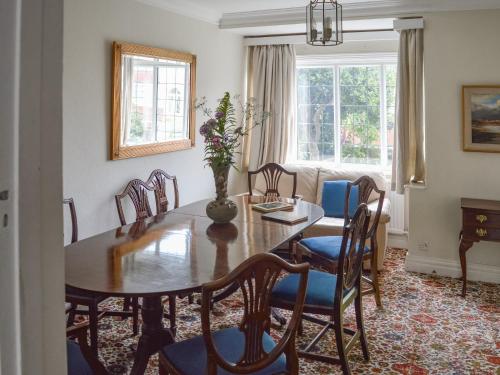 a dining room with a table and chairs at Number Three in Bridlington