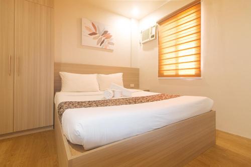 Katil atau katil-katil dalam bilik di Elyseah Condotel by RedDoorz