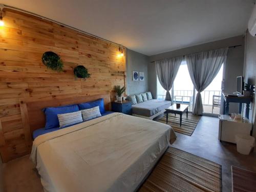 Ένα ή περισσότερα κρεβάτια σε δωμάτιο στο บ้านฟ้าใส รีสอร์ท เกาะล้าน