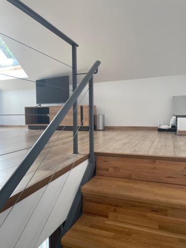 a staircase in a house with wooden floors at North Star - sea apartment in Balchik