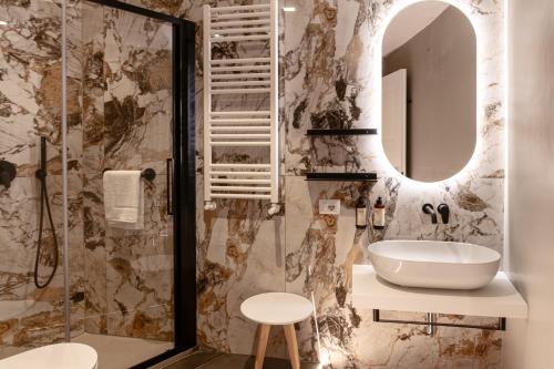a bathroom with a sink and a mirror at Flora Guest House in Rome