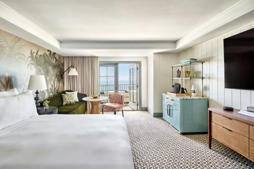 a hotel room with a bed and a living room at The Ritz-Carlton, Laguna Niguel in Dana Point